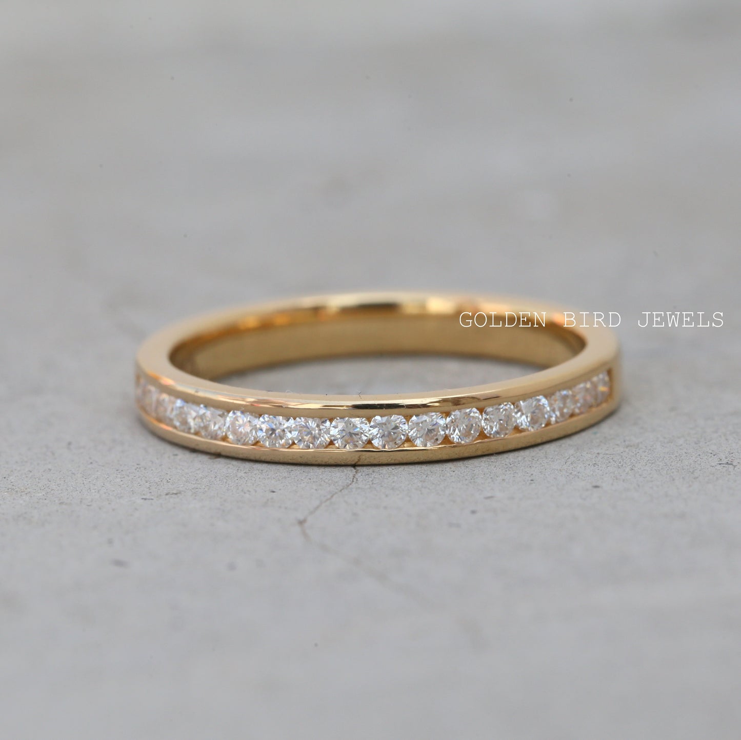 Channel Set Round Moissanite Wedding Band in 10K